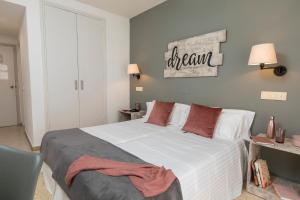 Postel nebo postele na pokoji v ubytování Hotel Bulevard