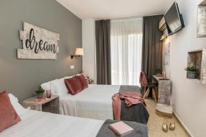 Postel nebo postele na pokoji v ubytování Hotel Bulevard