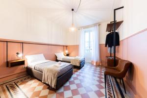 Posteľ alebo postele v izbe v ubytovaní REGO APARTMENTS - Boutique Aparthotel & Serenity Spa with some off-site apartments in the Heart of Bergamo City Center