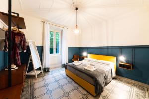 Posteľ alebo postele v izbe v ubytovaní REGO APARTMENTS - Boutique Aparthotel & Serenity Spa with some off-site apartments in the Heart of Bergamo City Center