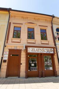 a building with two doors in front of it at PB Apartments in Spišská Nová Ves