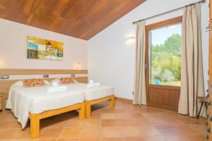 A bed or beds in a room at Son Ferragut