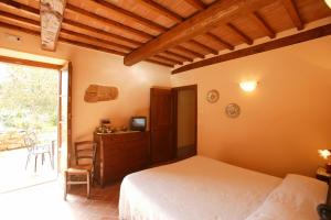 Posteľ alebo postele v izbe v ubytovaní Agriturismo Podere San Gregorio