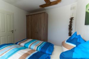 Postel nebo postele na pokoji v ubytování Haus Widmoos