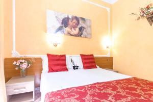 A bed or beds in a room at Downtown Accommodation