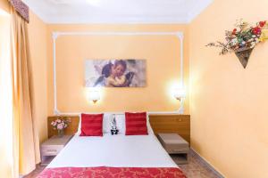 A bed or beds in a room at Downtown Accommodation
