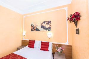 A bed or beds in a room at Downtown Accommodation