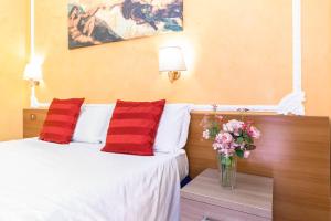 A bed or beds in a room at Downtown Accommodation