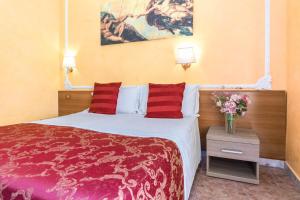 A bed or beds in a room at Downtown Accommodation