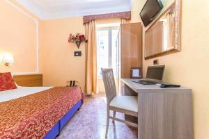 A bed or beds in a room at Downtown Accommodation