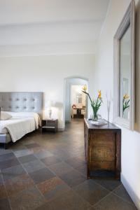 Ένα ή περισσότερα κρεβάτια σε δωμάτιο στο Hotel Maison Tresnuraghes