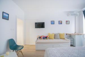 Televízia a/alebo spoločenská miestnosť v ubytovaní Guest house Mendi