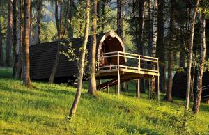 a tree house in the middle of a forest at Ferienparadies Natterer See in Innsbruck