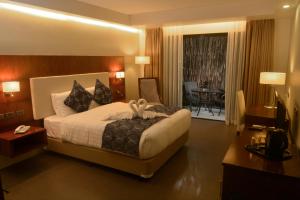 Postel nebo postele na pokoji v ubytování Ariana Hotel