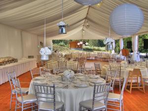 a tent set up for a wedding with tables and chairs at Hotel Zochova Chata - Adult friendly in Modra +66 photos