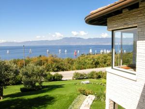 a house with a view of the water with sailboats at Villa Kamik by Interhome in Kostrena