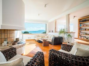 een woonkamer met meubilair en een groot raam bij Villa Kamik by Interhome in Kostrena +36 foto's