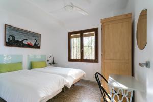 Ένα ή περισσότερα κρεβάτια σε δωμάτιο στο Apartamento Conquistadores Mazagon 2 Hab 4 Pers max