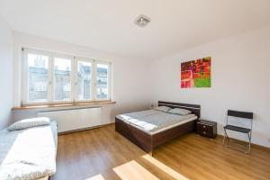 Postel nebo postele na pokoji v ubytování Lux Hostel - z prywatnymi łazienkami