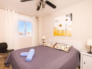 a bedroom with a bed and a ceiling fan at Apartment Reina Sofia II by Interhome in Estepona
