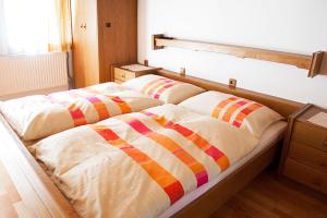 A bed or beds in a room at Ferienhaus Meissnitzer