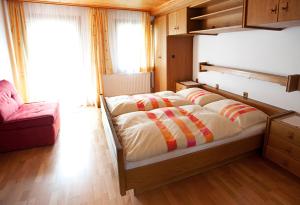 Кровать или кровати в номере Ferienhaus Meissnitzer