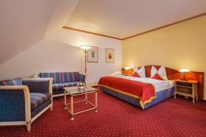 Postel nebo postele na pokoji v ubytování Luitpoldpark-Hotel