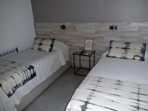 Postel nebo postele na pokoji v ubytování Hotel Tunuyan