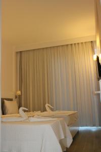 A television and/or entertainment centre at LİMAN BOUTIQUE OTEL