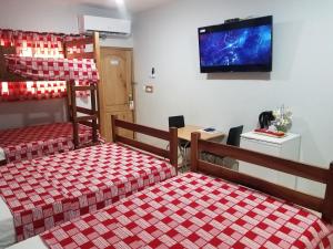 Postel nebo postele na pokoji v ubytování Sharp Guesthouse