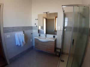 Koupelna v ubytování Living Piraino case vacanze