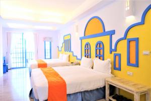 Uma cama ou camas num quarto em Yujian Kending Tese Homestay