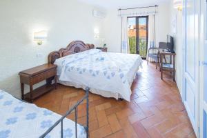 a hotel room with two beds and a television at Hotel Colonna San Marco in Porto Rotondo +51 photos