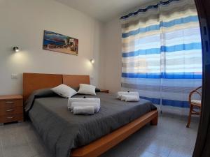 Postel nebo postele na pokoji v ubytování Living Piraino case vacanze