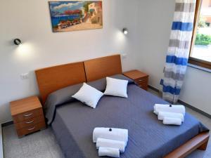 Postel nebo postele na pokoji v ubytování Living Piraino case vacanze