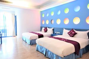 Uma cama ou camas num quarto em Yujian Kending Tese Homestay