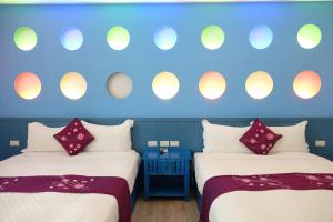 Uma cama ou camas num quarto em Yujian Kending Tese Homestay