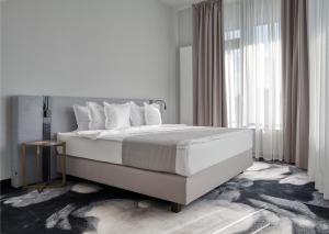 Voodi või voodid majutusasutuse Hotel River Park toas