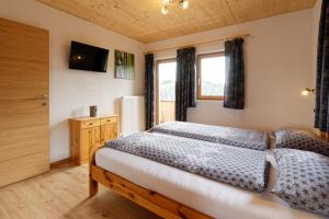 Postel nebo postele na pokoji v ubytování Kehrerhof Urlaub auf dem Bauernhof