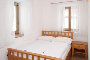 Ein Bett oder Betten in einem Zimmer der Unterkunft Serviced Apartement Sonnleitner