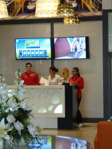 a group of people standing behind a counter in a room at Relax Hotel Casa Voyageurs in Casablanca
