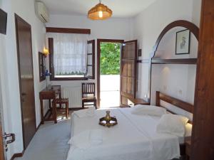 Posteľ alebo postele v izbe v ubytovaní Hotel Vrionis