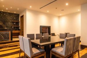 a dining room with a table and chairs at Marsella 45 in Hermosillo