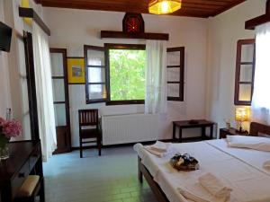 Posteľ alebo postele v izbe v ubytovaní Hotel Vrionis