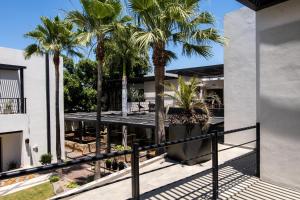 an external view of a house with palm trees at Marsella 45 in Hermosillo