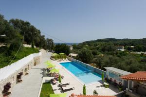 a view of a swimming pool with a resort at MARIS PARGA in Parga