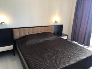 Una cama o camas en una habitación de PSB Apartments Hotel Heaven