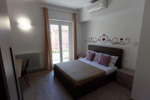 Postel nebo postele na pokoji v ubytování Le Coccole