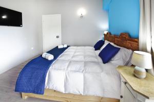 A bed or beds in a room at Relais Lo Stagnone
