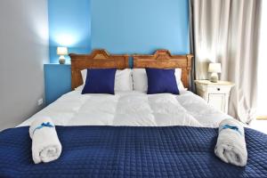 A bed or beds in a room at Relais Lo Stagnone